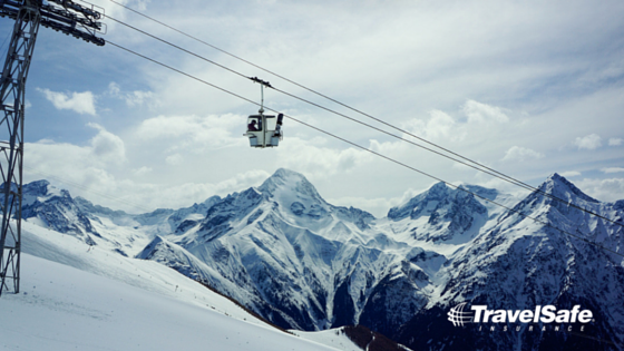 Skier_in_chairlift-travel-insurance-for-ski-trips.png